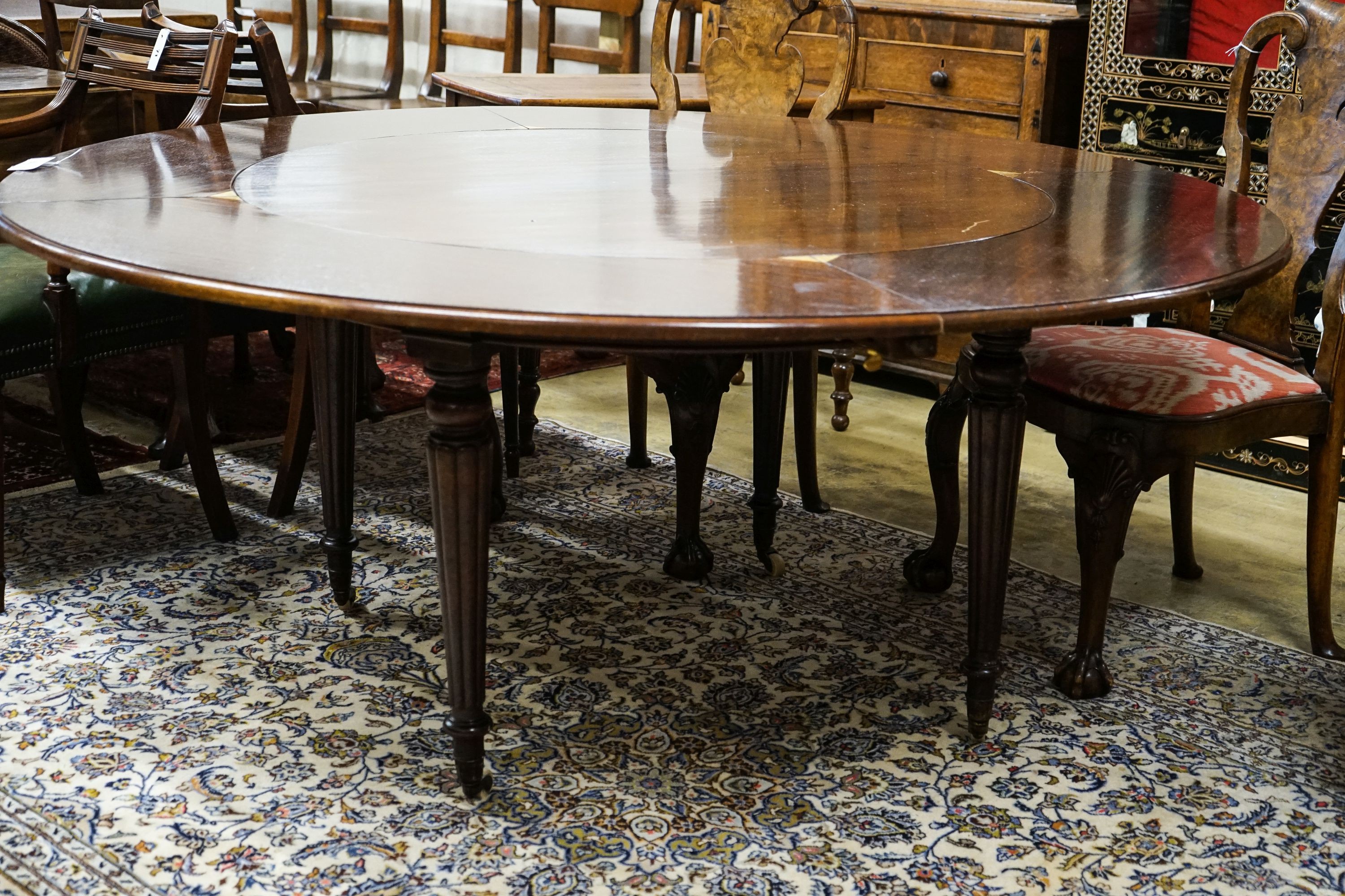 A Victorian and later circular mahogany extending dining table, 170cm diameter, height 70cm